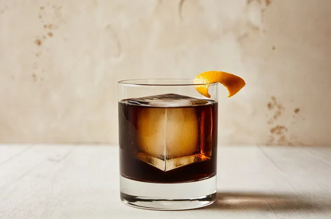 Coffee Negroni cocktail in a rocks glass with orange twist garnish
